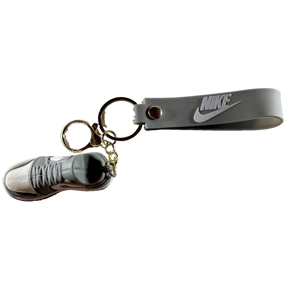 Grey & white miniature Nike Keychain styled like an Air Jordan wrist strap/bag